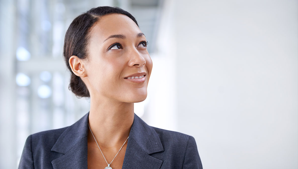 business woman smiling looking upwards