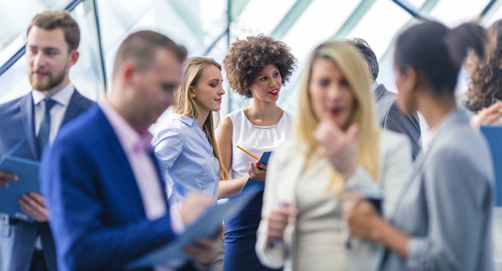 Multi ethnic group of business people attending a meeting in the office building