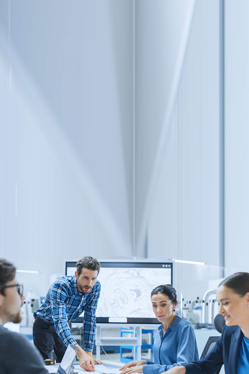 Modern Factory Office Meeting Room: Busy Diverse Team of Engineers, Managers and Investors Talking at Conference Table, Use Interactive TV, Analyze, Find Solutions, Debate and Discuss Engine Concept