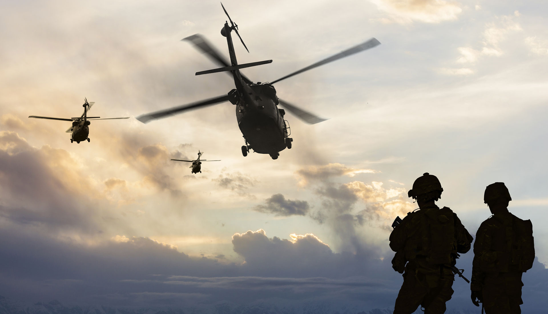 soldiers and helicopters in silhouette showing soldiers going to complete a mission planned and developed by AI software technolgy