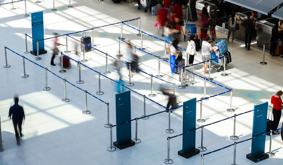 people checking in at airport