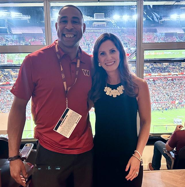 employee with washington commander athlete