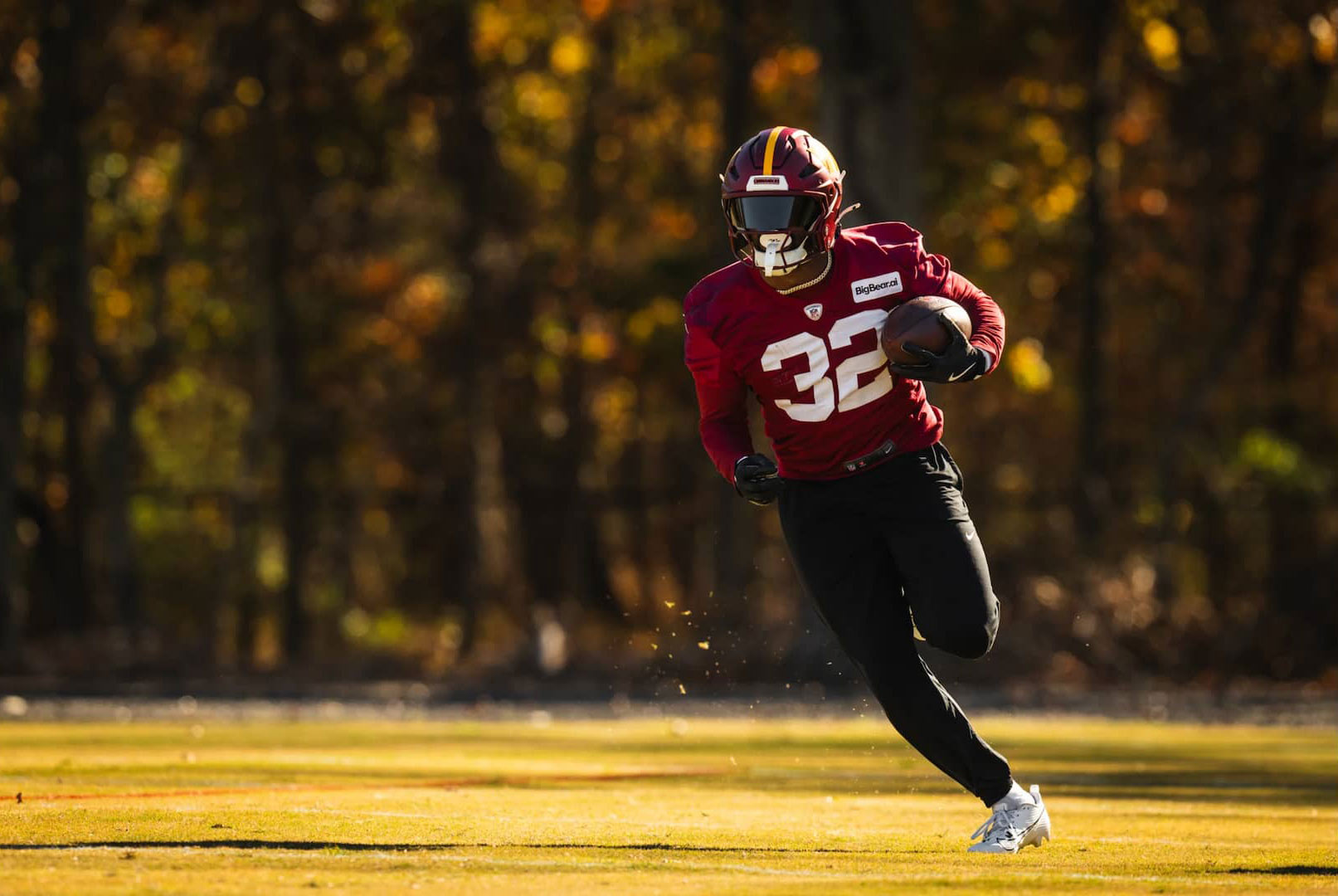 running with football